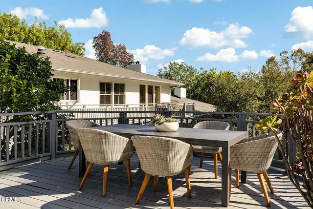 a view of a park with iron fence