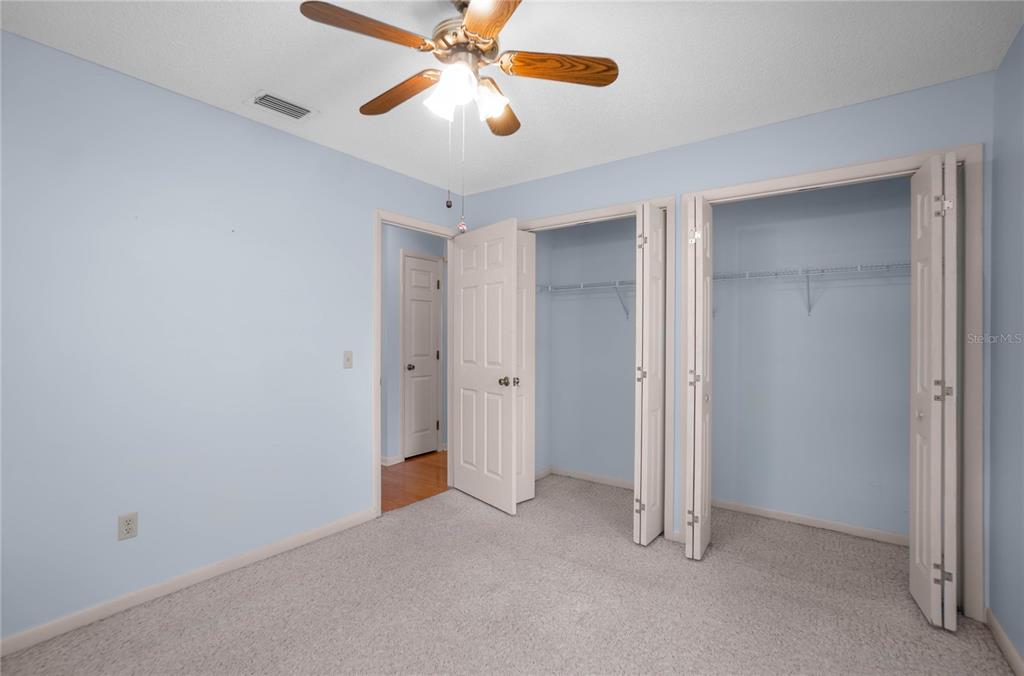 3341 South Jean Point Inverness, FL 34450 - Photo 16 of 39 an empty room with closet and a chandelier fan