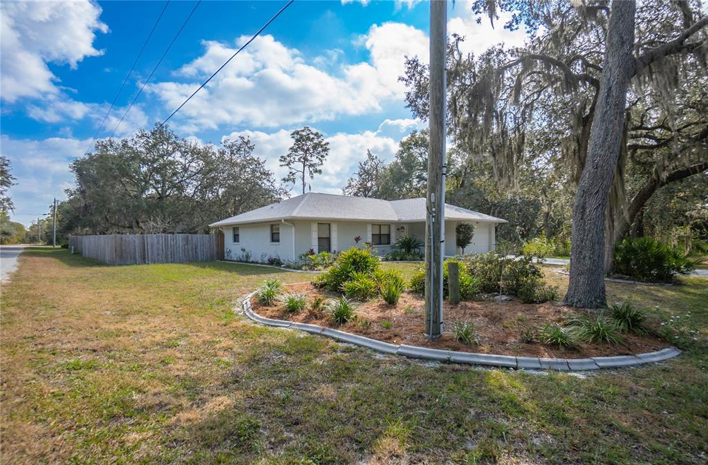 3341 South Jean Point Inverness, FL 34450 - Photo 29 of 39 a view of a house with backyard and garden