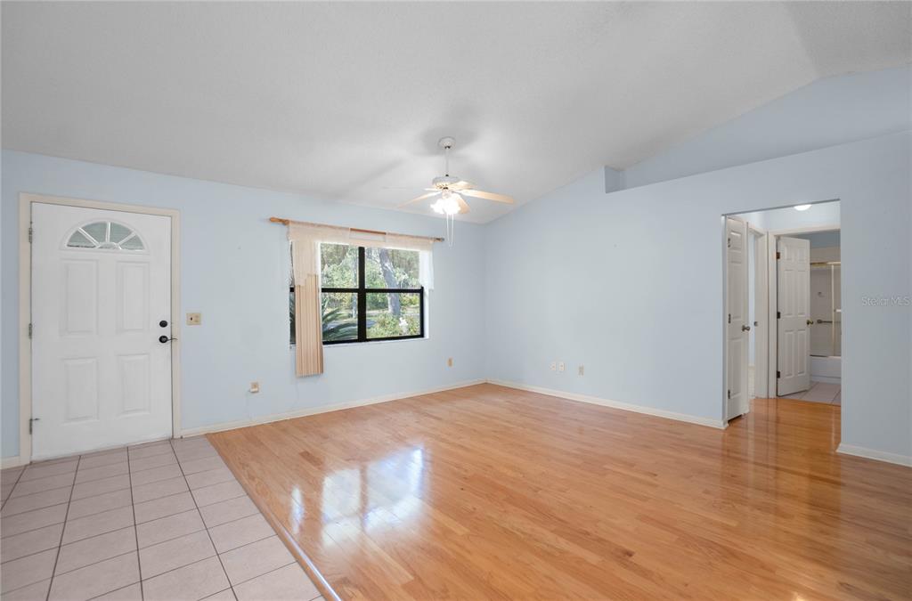 3341 South Jean Point Inverness, FL 34450 - Photo 3 of 39 a view of an empty room with window and wooden floor