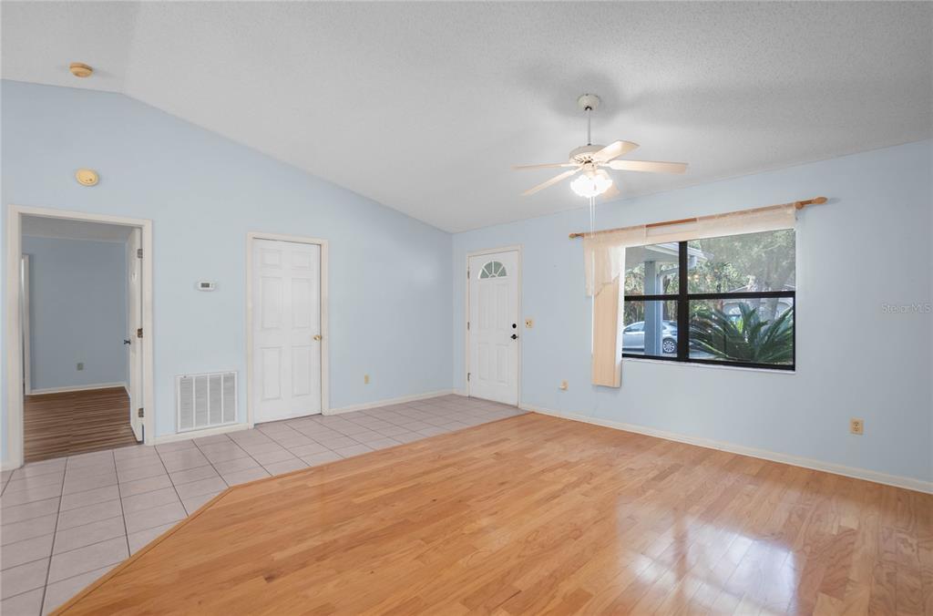 3341 South Jean Point Inverness, FL 34450 - Photo 6 of 39 a bedroom with a large bed and a chandelier fan