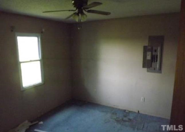 1535 Auctioneer Road Clinton, NC 28328 - Photo 8 of 10 an empty room with a window