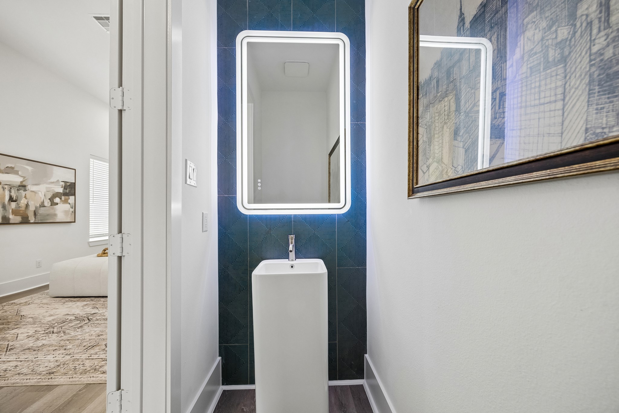 1618 Ojeman Road, Unit A Houston, TX 77055 - Photo 7 of 39 This powder room with its beautiful tile accent wall is tucked away near the second floor living area.