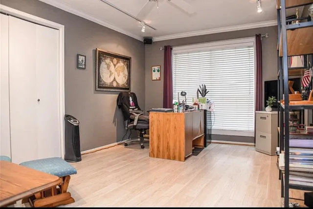 a bed room with a bed and a chair