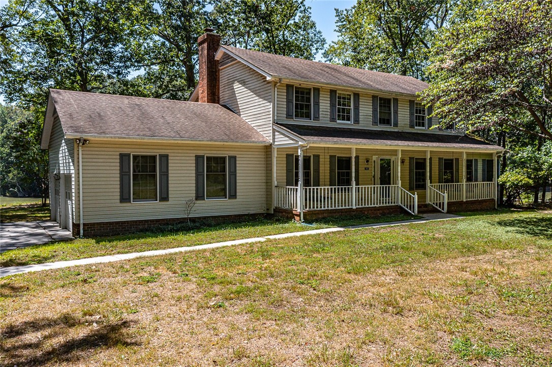 148 Denver Road Heathsville, VA 22473 - Photo 1 of 50 View of front of home featuring a chimney, a front lawn, a porch, and roof with shingles