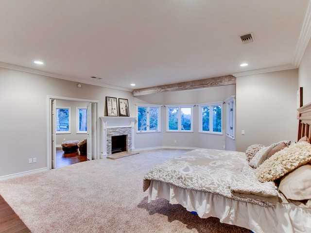 119 Morro Hills Road Fallbrook, CA 92028 - Photo 14 of 25 Master bedroom on entry level with fireplace and sitting room