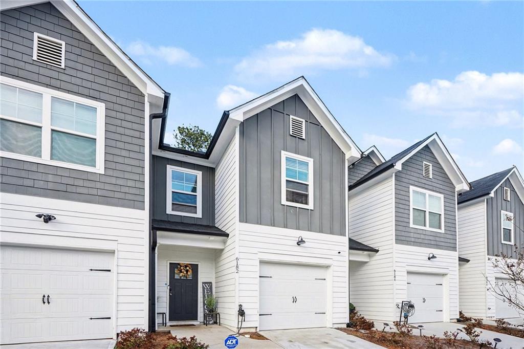 a front view of a house with a garage