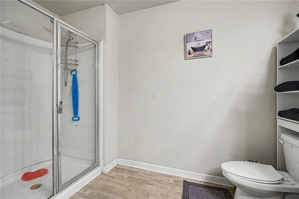 6182 Redan Overlook, Unit 97 Lithonia, GA 30058 - Photo 18 of 23 a bathroom with a toilet and a shower