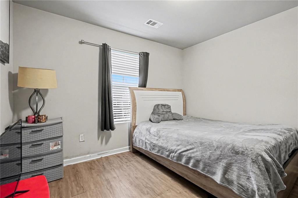 6182 Redan Overlook, Unit 97 Lithonia, GA 30058 - Photo 21 of 23 a bedroom with a bed and a window