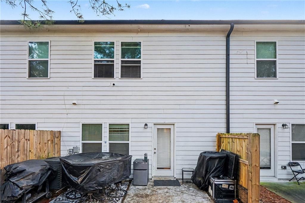 6182 Redan Overlook, Unit 97 Lithonia, GA 30058 - Photo 23 of 23 a view of a house with a car parked in front of it