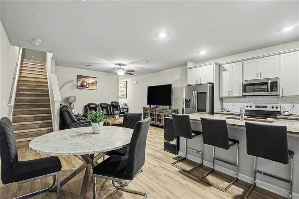 6182 Redan Overlook, Unit 97 Lithonia, GA 30058 - Photo 8 of 23 a view of a dining room with furniture
