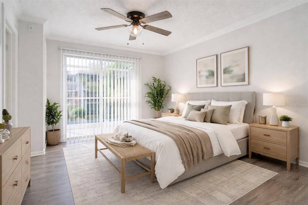 129 Blue Pointe Way, Unit 340 Altamonte Springs, FL 32701 - Photo 14 of 25 a spacious bedroom with a large bed and a chandelier