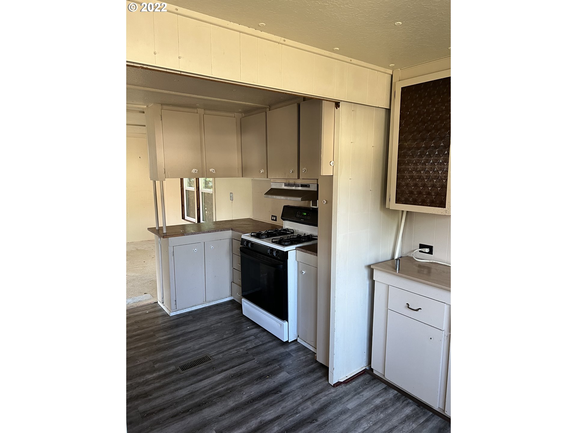 60 Neptune Avenue Springfield, OR 97477 - Photo 6 of 15 a kitchen with stainless steel appliances a stove and a refrigerator