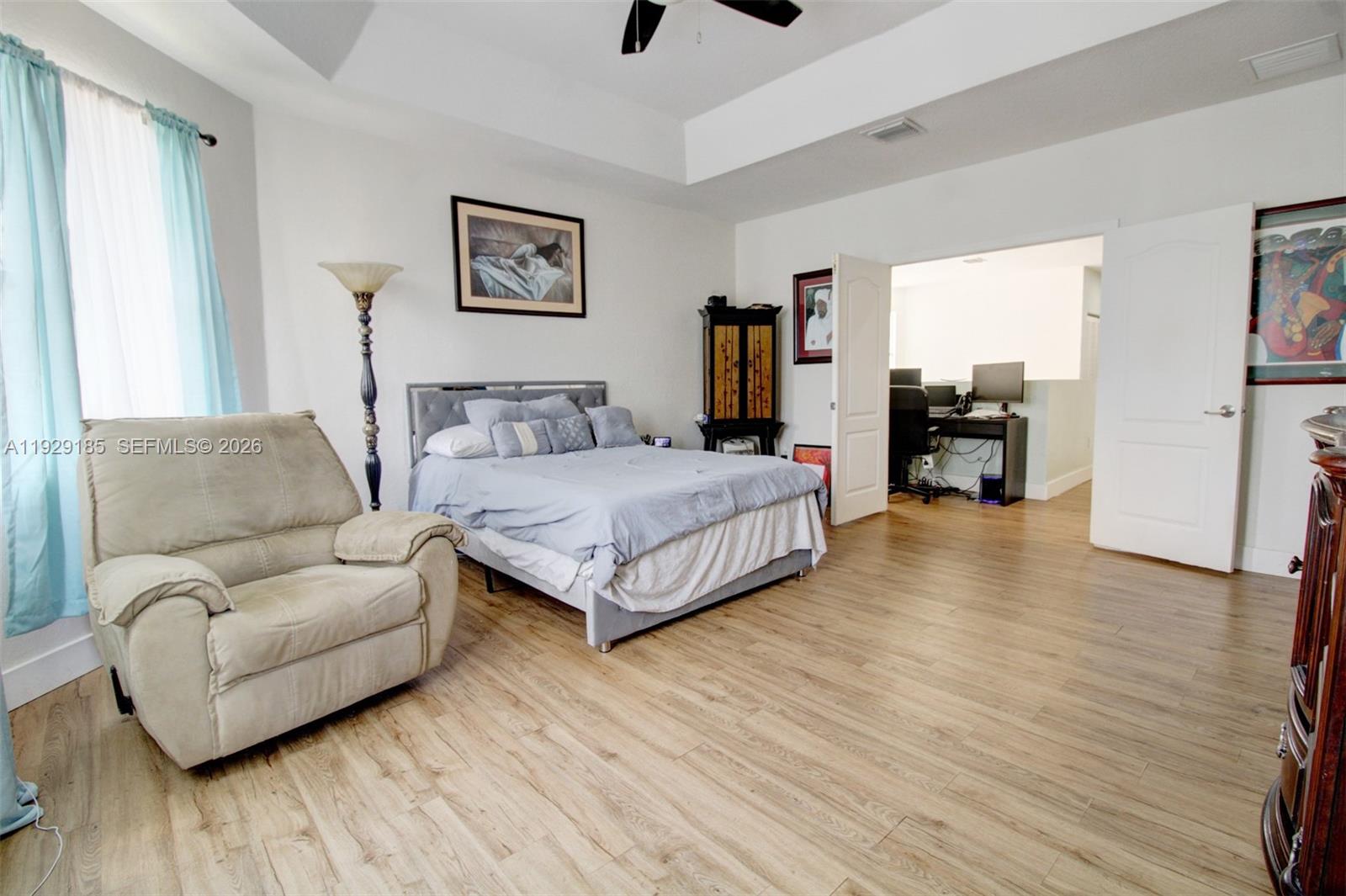 1156 Northeast 37th Place Homestead, FL 33033 - Photo 15 of 35 a living room with furniture and a wooden floor