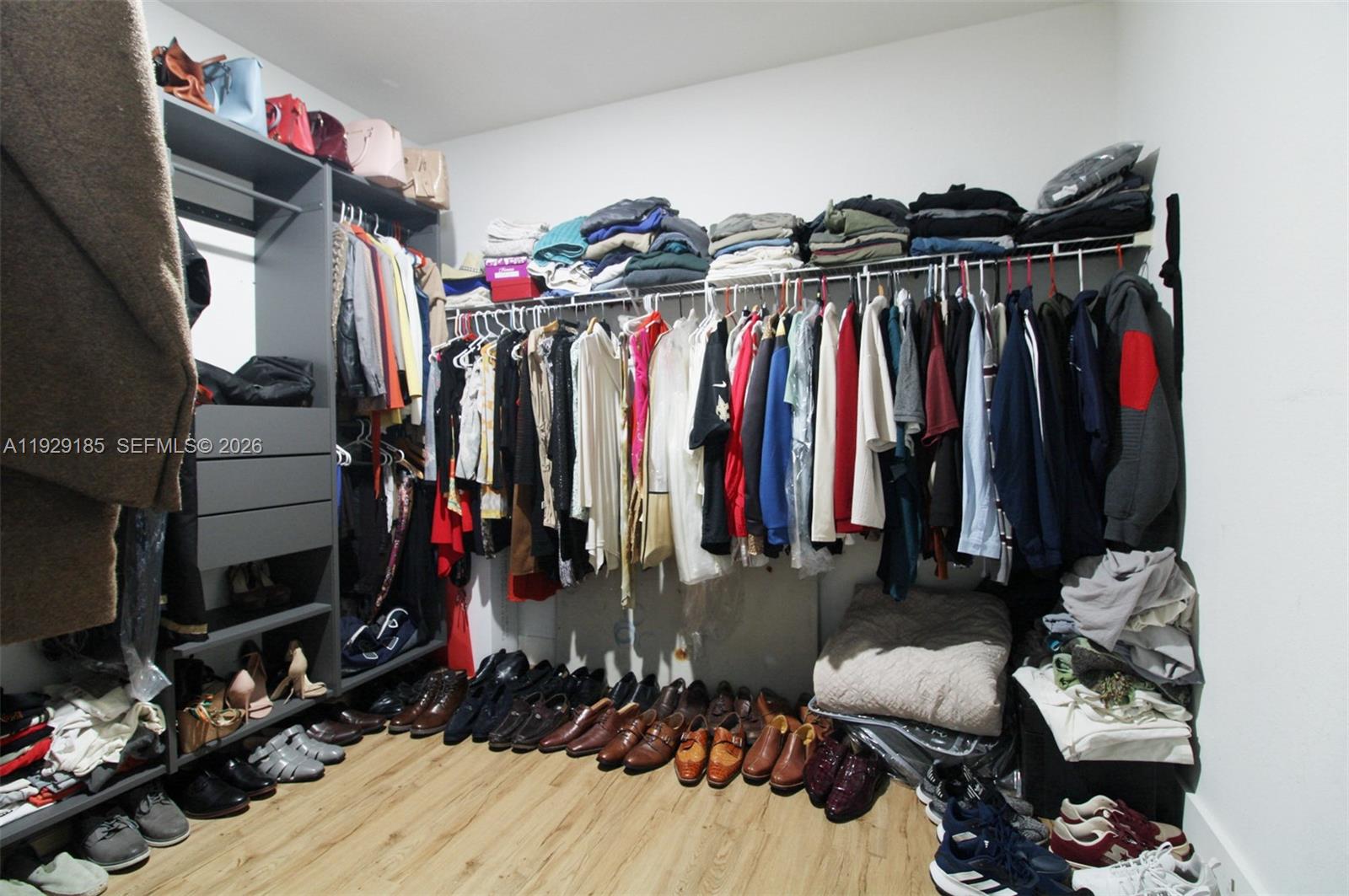 1156 Northeast 37th Place Homestead, FL 33033 - Photo 19 of 35 a view of walk in closet with clothes