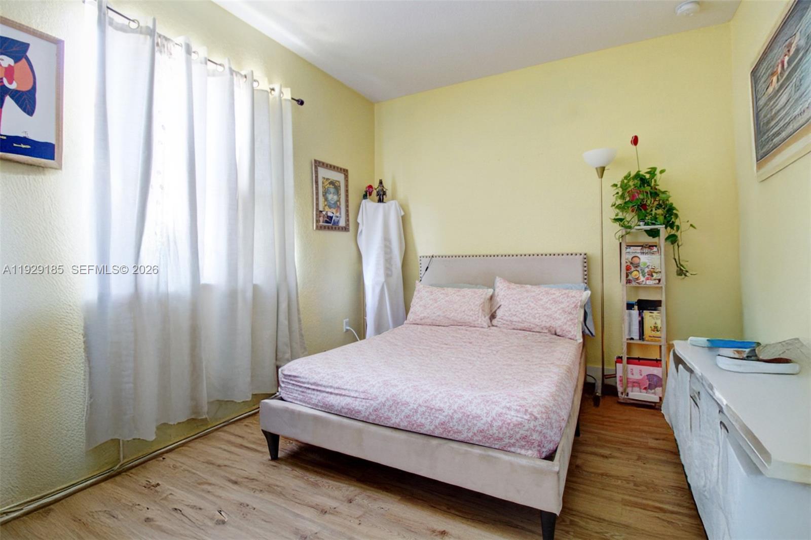 1156 Northeast 37th Place Homestead, FL 33033 - Photo 24 of 35 a spacious bedroom with a bed and a window