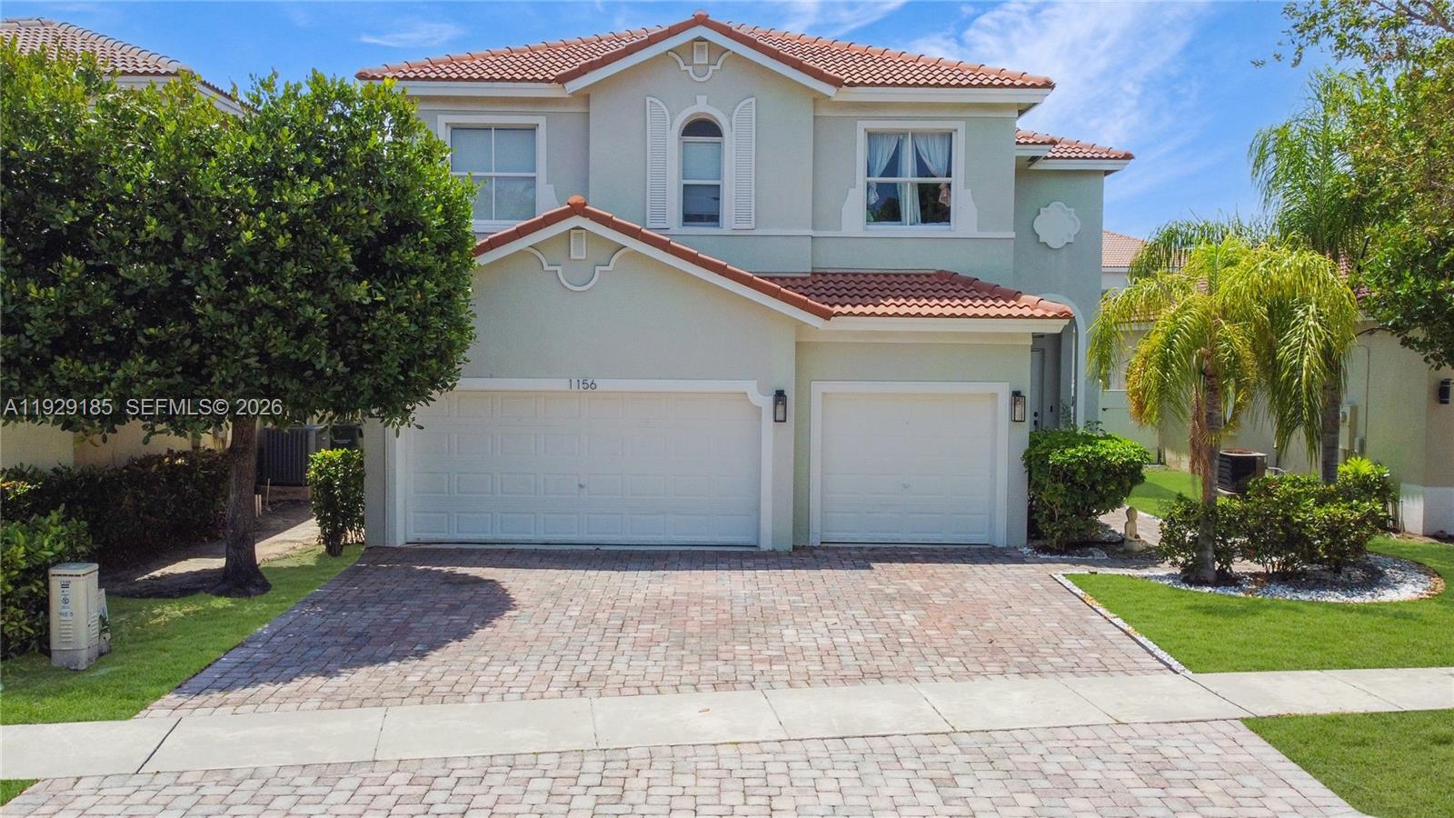 1156 Northeast 37th Place Homestead, FL 33033 - Photo 35 of 35 a front view of a house with a yard
