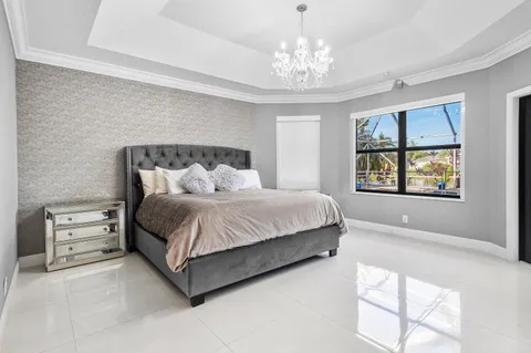 a spacious bathroom with a tub sink shower and mirror