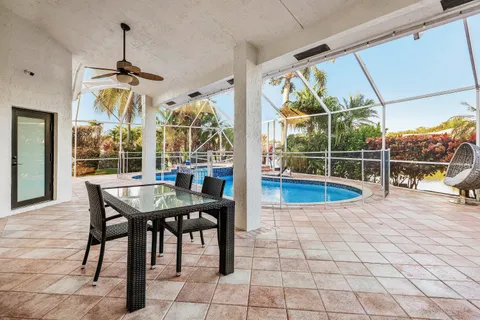 a view of a swimming pool with a porch