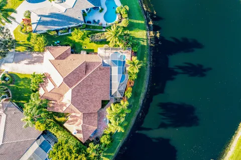 an aerial view of a house with a yard basket ball court
