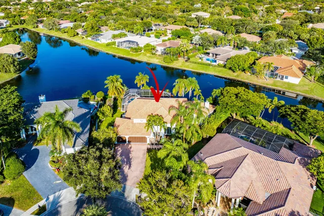 an aerial view of residential houses with outdoor space and street view