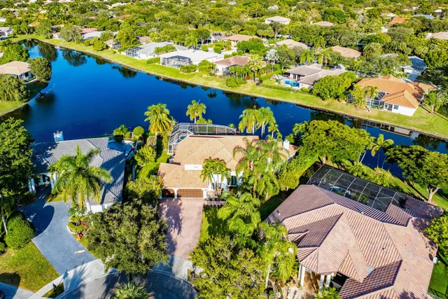 an aerial view of residential houses with outdoor space and street view
