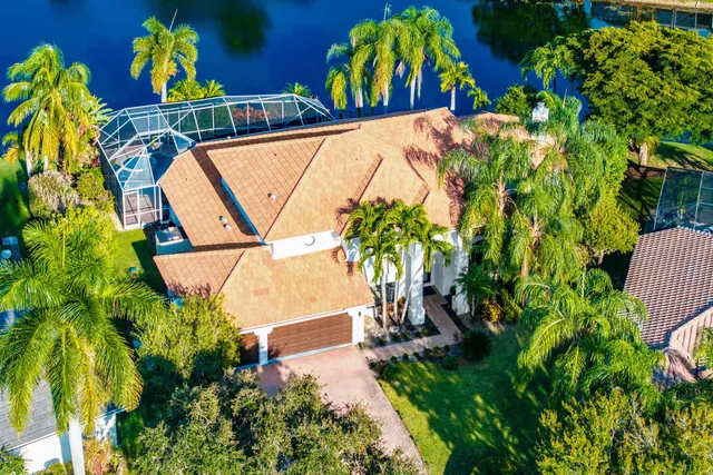 a view of a house with a yard and garden