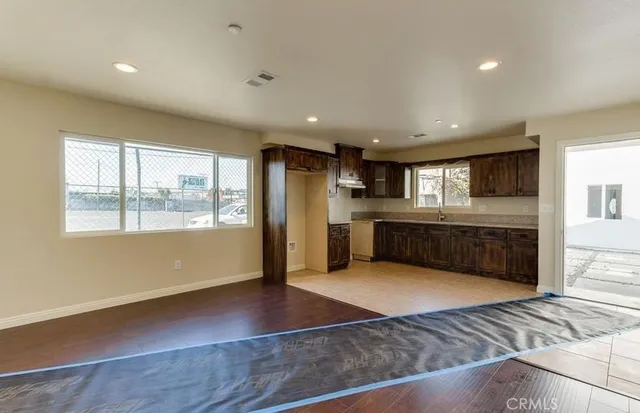 a view of a kitchen with a sink and a window