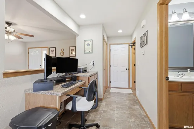 a workspace with furniture and bathroom