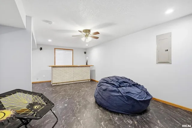 a living room with a couch and a chandelier