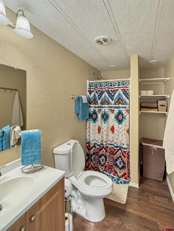 a white toilet sitting next to a bathroom sink