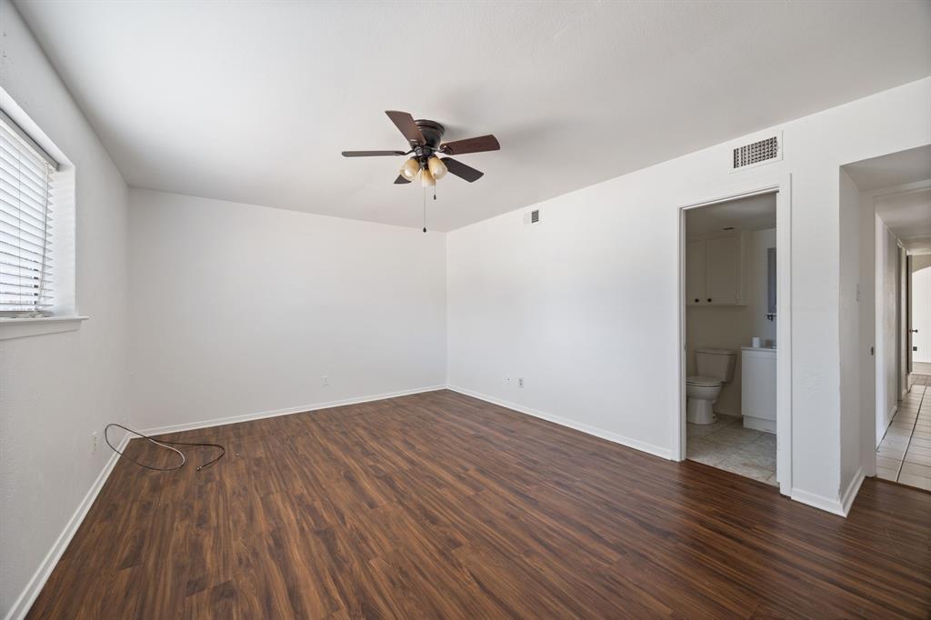 2736 Chebi Lane Denton, TX 76209 - Photo 14 of 27 an empty room with wooden floor and ceiling fan