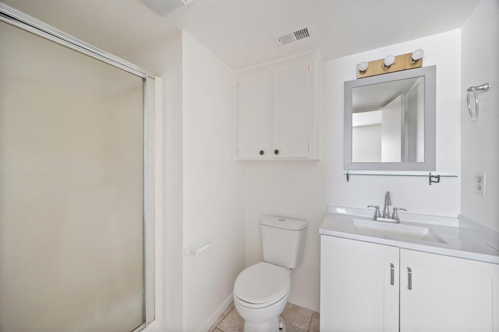 2736 Chebi Lane Denton, TX 76209 - Photo 16 of 27 a bathroom with a sink a toilet and a mirror