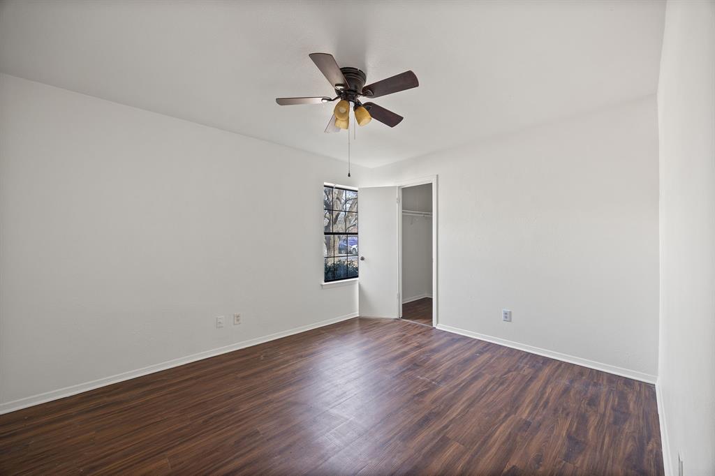 2736 Chebi Lane Denton, TX 76209 - Photo 18 of 27 a view of wooden floor and a chandelier fan in a room