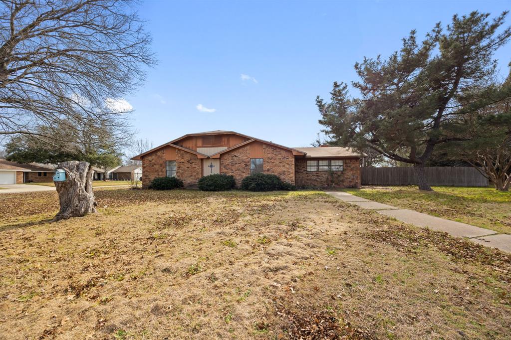 2736 Chebi Lane Denton, TX 76209 - Photo 2 of 27 a front view of a house with a yard