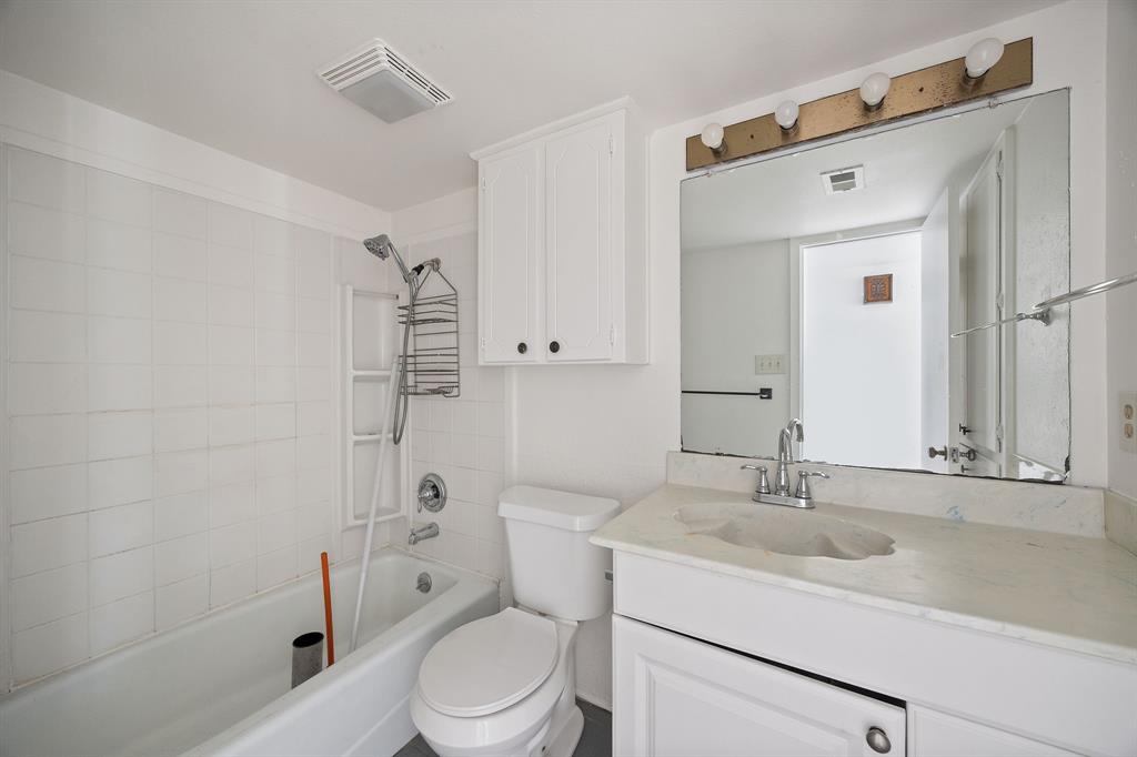 2736 Chebi Lane Denton, TX 76209 - Photo 21 of 27 a bathroom with a sink toilet a mirror and shower