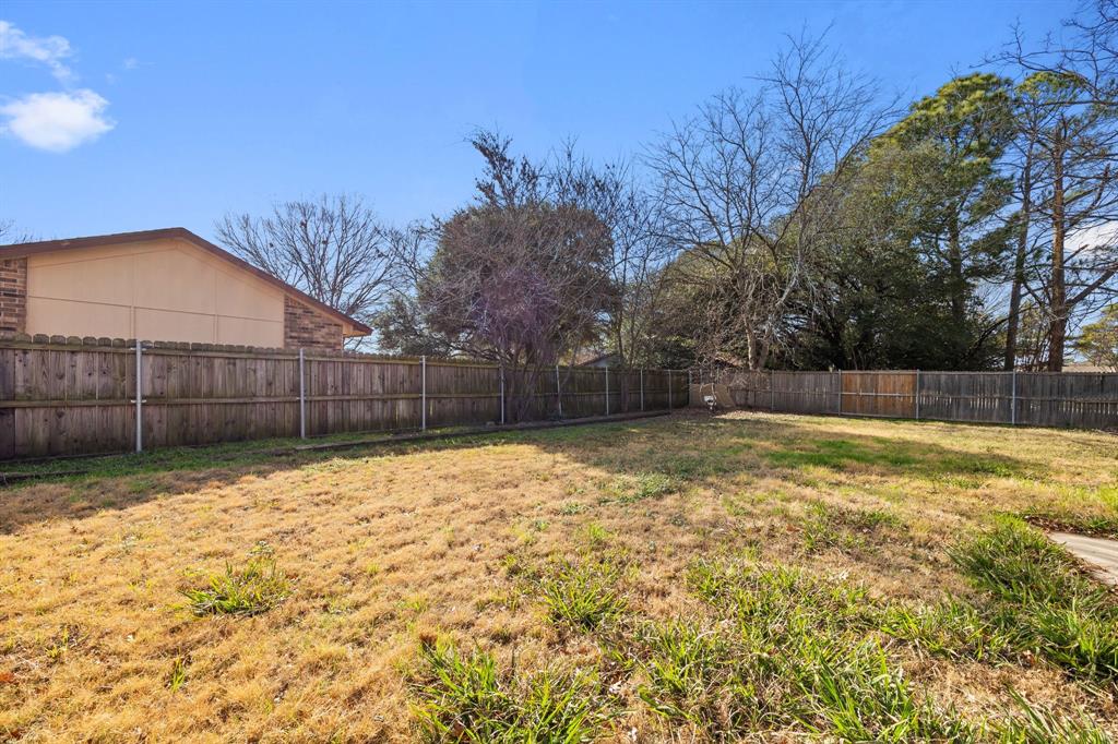 2736 Chebi Lane Denton, TX 76209 - Photo 25 of 27 a view of backyard with wooden fence