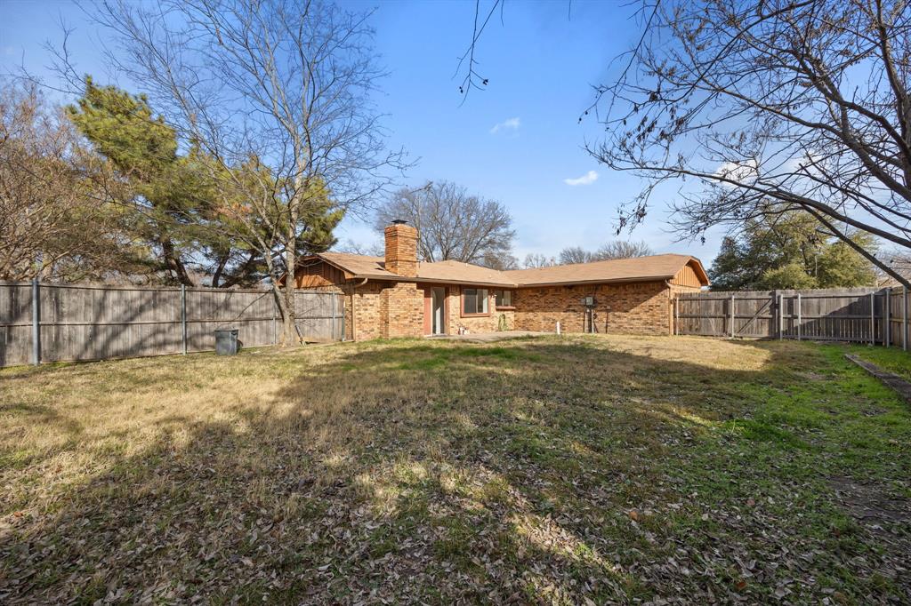 2736 Chebi Lane Denton, TX 76209 - Photo 26 of 27 a view of a house with a yard