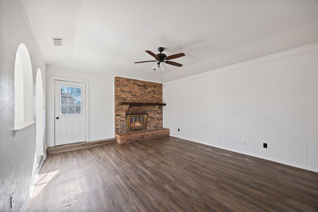 2736 Chebi Lane Denton, TX 76209 - Photo 6 of 27 wooden floor in an empty room with a window