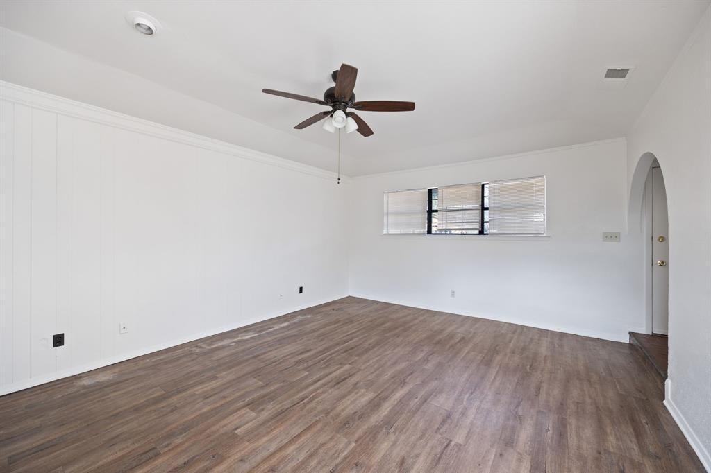 2736 Chebi Lane Denton, TX 76209 - Photo 7 of 27 an empty room with wooden floor and windows