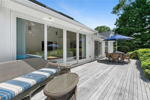 a balcony with furniture and a garden