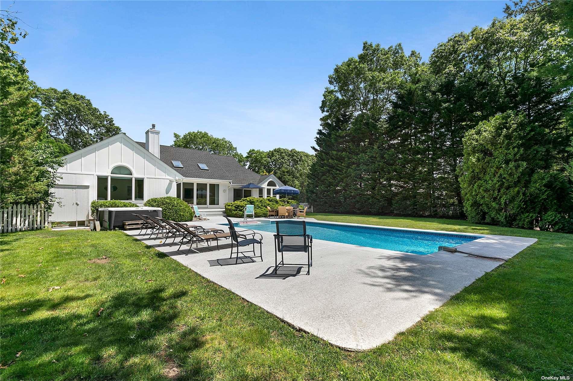 43 Bridle Path Westhampton Beach, NY 11978 - Photo 2 of 15 a aerial view of a house with swimming pool garden and patio