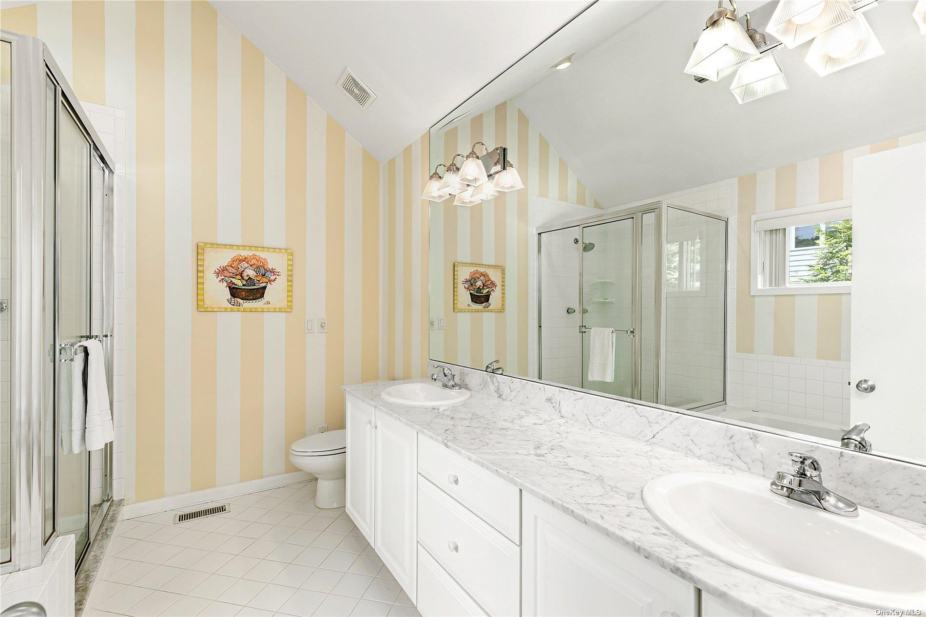 43 Bridle Path Westhampton Beach, NY 11978 - Photo 9 of 15 a spacious bathroom with a double vanity sink mirror and a shower