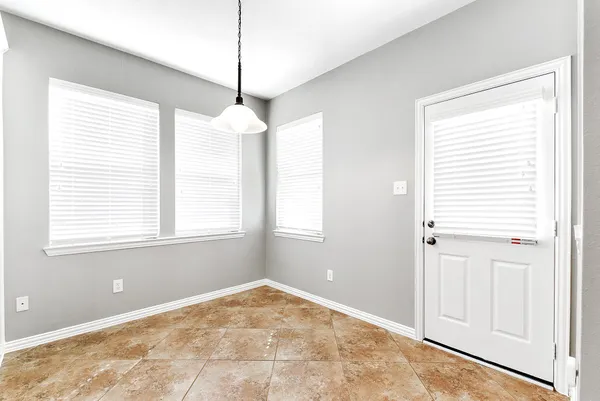 a view of a room that has a window in it