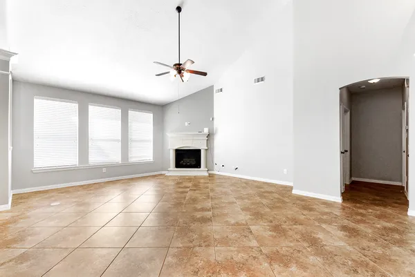 a view of an empty room with a fireplace