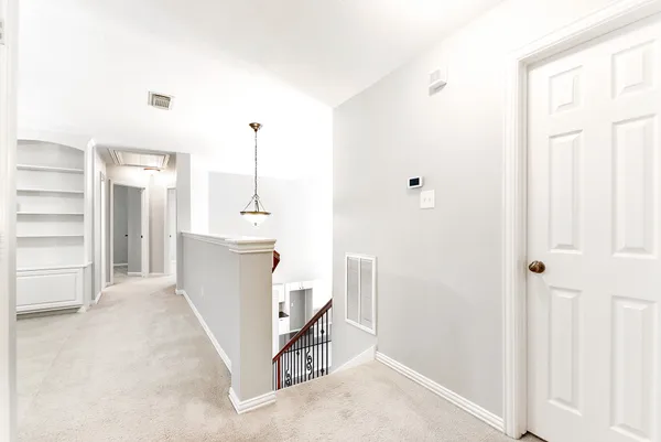 a view of a kitchen with storage and utility room