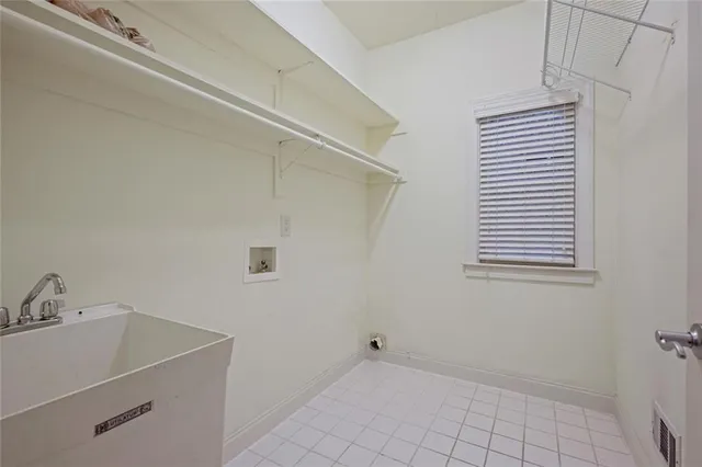 a view of a utility room with a sink