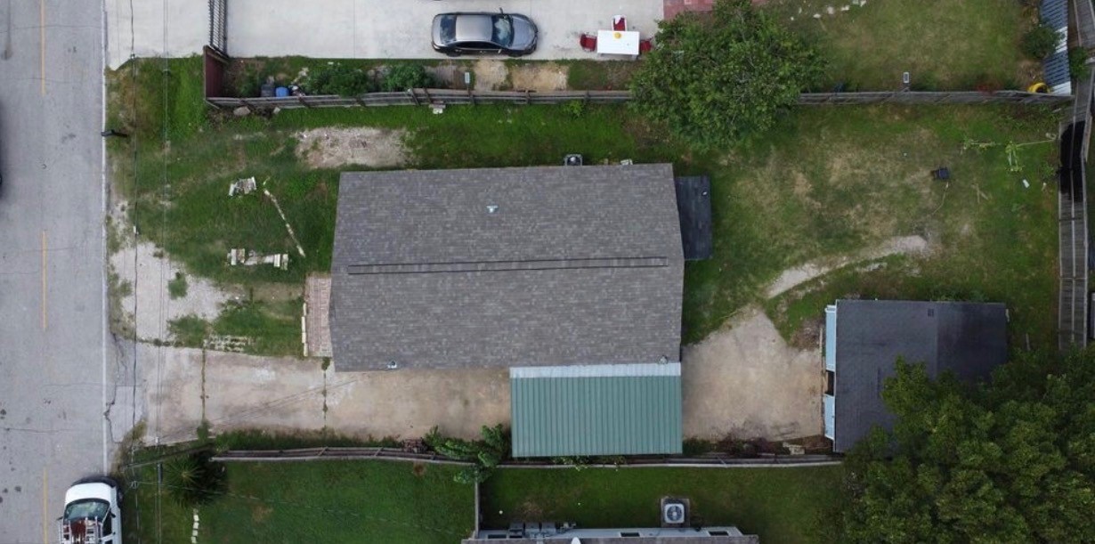 2415 Perry Street Baytown, TX 77521 - Photo 7 of 7 an aerial view of a house with a yard