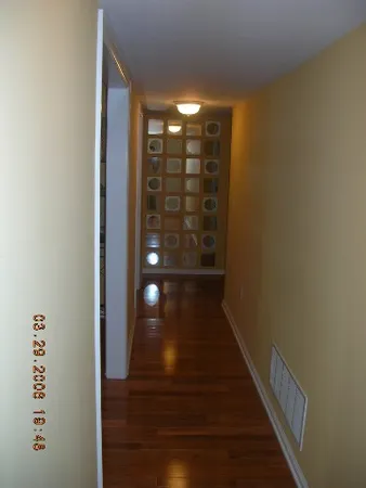 a view of gallery with wooden floor