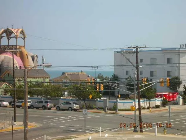 a view of a city street with cars